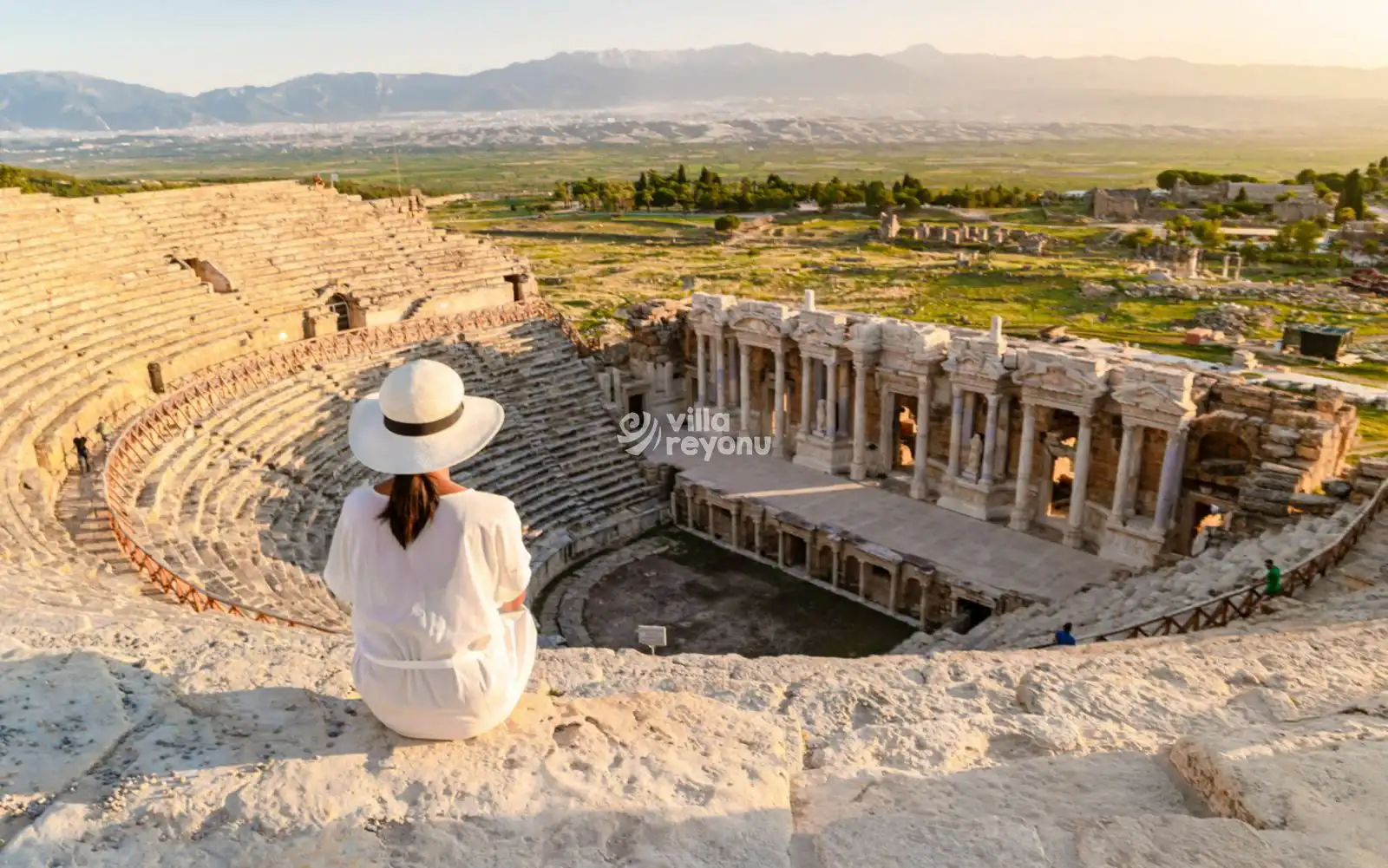 a woman sitting at the amphitheatre